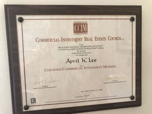 Framed certificate for Commercial Investment Real Estate Council, by certified member, April Lee